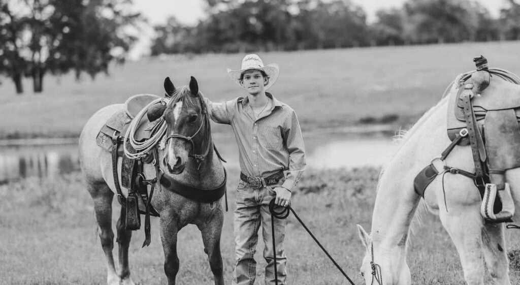Judson standing with Horses on Rural Ranch Property